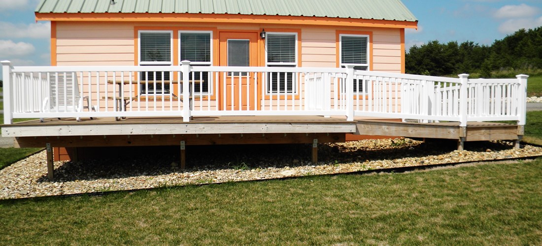 DELUXE CABIN ADA Exterior 4 PERSON 
Wheel chair ramp , portable grill  Lake side view