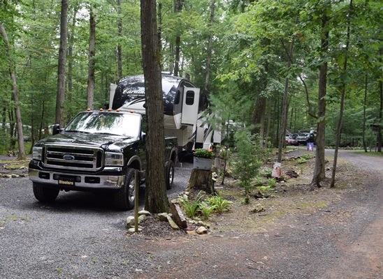 Easy access sites with a real camping atmosphere. Very Spacious wooded sites, 30 amp water and electric, are offered throughout the park. No need to unhook tow vehicles.