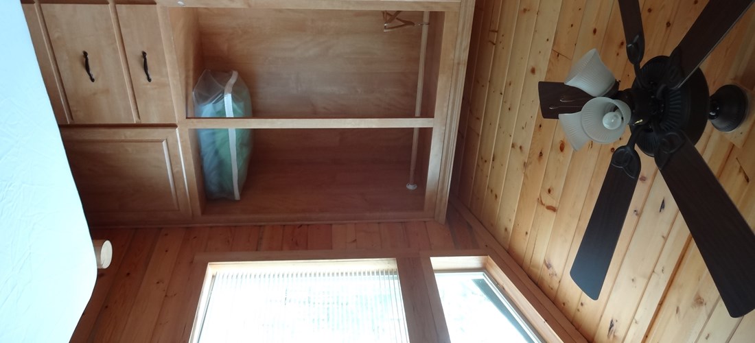 The bedroom includes a queen bed and linens are provided.