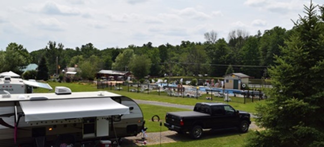 These sunny, non wooded, full hookup 30 amp sites are located close to everything. Near the store, swimming pool and playground. Close to Bath House & all the activities. Nice area for small groups.