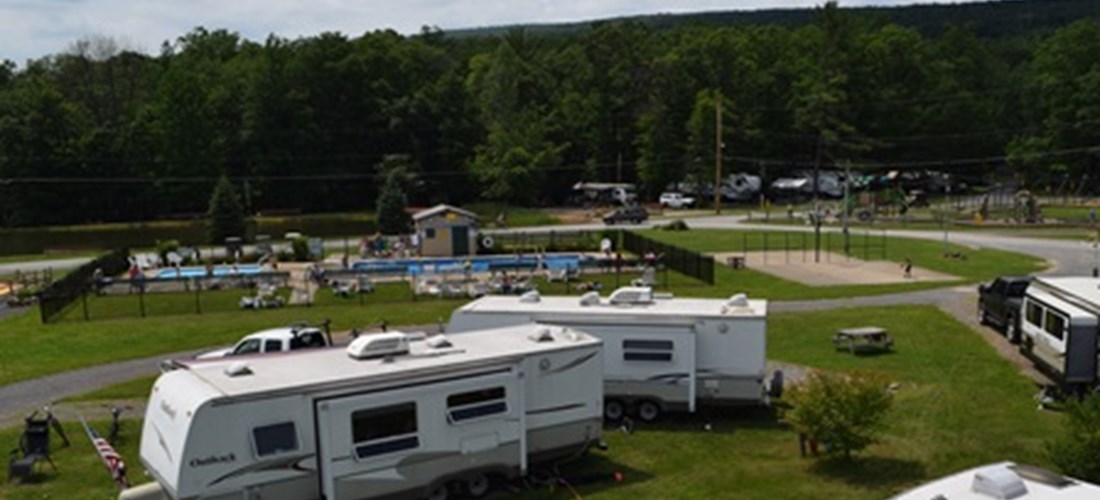 These sunny, non wooded, full hookup 30 amp sites are located close to everything. Near the store, swimming pool and playground. Close to Bath House & all the activities. Nice area for small groups.