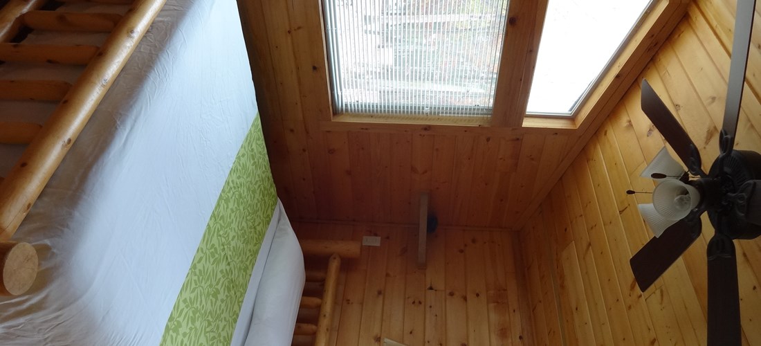 The Deluxe Cabin includes a queen bed and linens are provided.
