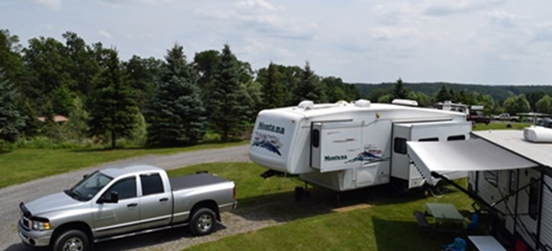 These sunny, non wooded, full hookup 30 amp sites are located close to everything. Near the store, swimming pool and playground. Close to Bath House & all the activities. Nice area for small groups.