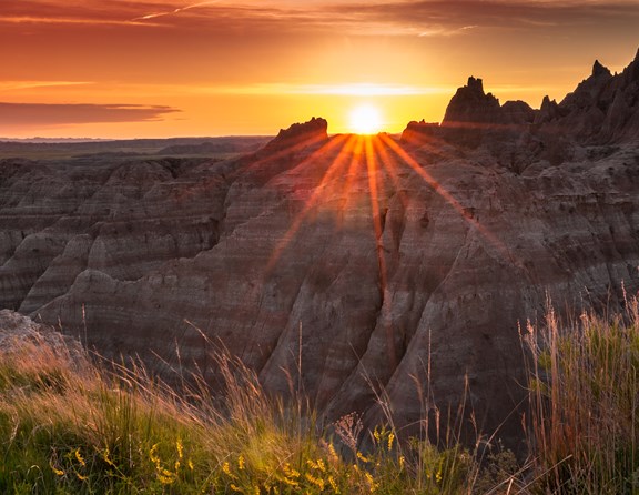 Badlands National Park in South Dakota has a mixture of rugged geologic formations and preserved fossils and mixed-grass prairies. With its unique features, other-worldly appearance, geologic history and fossil beds, there is much to explore and appreciate here so you may want to camp nearby for a few days!  Whether you prefer to stay in an RV, tent or cabin accommodation, there are several KOA campgrounds in the Badlands National Park area that would be a great base camp to explore from. Whether you are coming from the east or west to visit the Badlands, there are nearby KOA locations on your way as well as a campground just four miles from the park's Interior Entrance. 