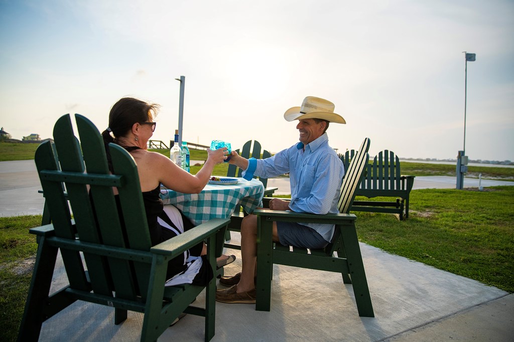 Couple toasting a sunny day at the campground.